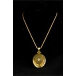 A Victorian 18ct gold locket with old cut diamond to the centre; approximately ½ct, 27.4g, with a