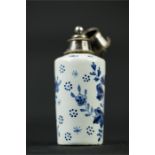 A blue and white Delft scent bottle.