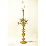 A gilt metal lamp base in the form of flowers and corn.