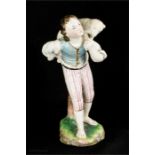 A Vienna porcelain 18th century figure of a shepherd carrying a lamb.