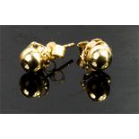 A pair of 9ct gold ear studs.