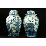 A pair of large Chinese blue and white jar and covers. 48cm high