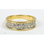 An 18ct gold and diamond ring set with 28 diamonds in a double hoop.