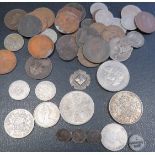 A quantity of mixed coins to include silver Threepenny pieces, Crowns, a silver tag, a Guernsey 1830