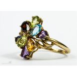 A gold multi gem ring set with diamond, amethyst, citrine, peridot etc.