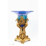 An ormolu centrepiece with later hand blown glass liner, cast with pheonix.