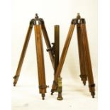 A brass telescope with two treen and brass stands.