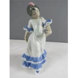 A Lladro figure of a girl dancing.