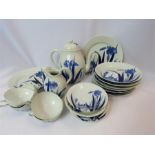 A blue and white porcelain tea set, depicting irises.