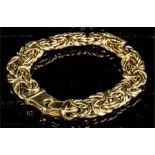 A 14ct gold Italian bracelet with safety chain, 15.1g.