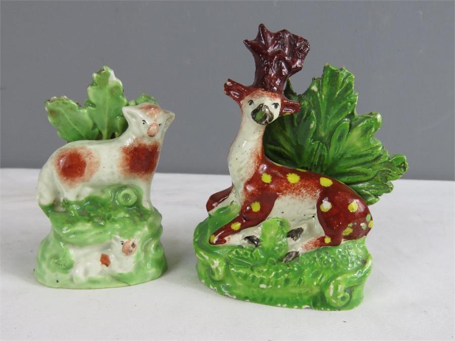 Two early Staffordshire figures; sheep and a deer.