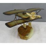 A model Vintage aeroplane, raised on an agate slice base signed De Matt. [All proceeds of sale for