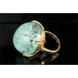 A large 18ct gold turquoise ring, of ovate form, in a chased gold mount, circa 1970, 25.2g total