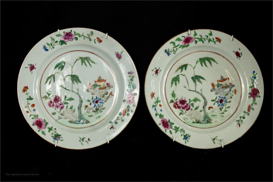 A pair of Chinese plates, 18th century with enamelled decoration and peonies to the border.