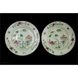 A pair of Chinese plates, 18th century with enamelled decoration and peonies to the border.