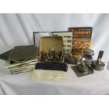 A group of railway memorabilia including a hat, gloves and books.