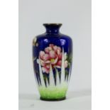 A Gu Bai enamelled miniature vase, circa 1900, decorated with peonies on a cobalt blue ground.