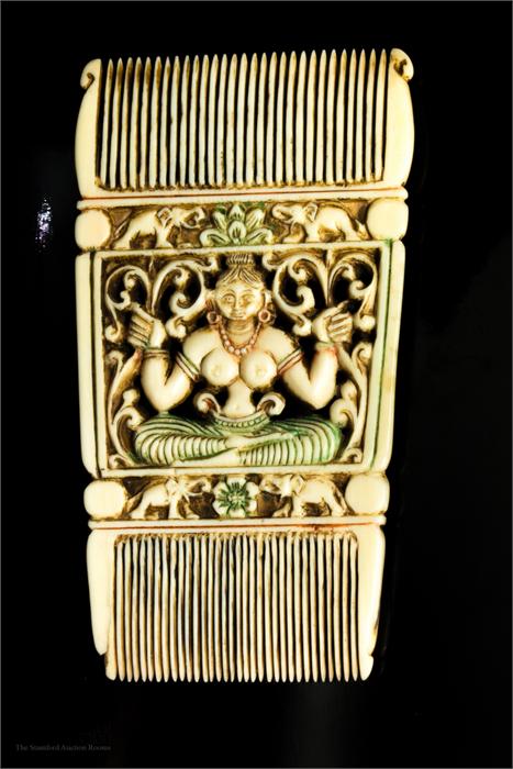A Moghul Indian bone carved comb.