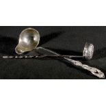 20th Century continental white metal toddy ladle, with entwined vine handle and a boat shaped bowl,