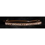 Diamond bar brooch, with line of nineteen uniform rose cut diamonds,