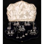Edwardian seven piece silver cruet set, maker VB & S, Chester 1906, cased with five spoons,