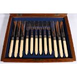 Edwardian walnut cased set of ivory handled fish knives and forks, with rope twist handles, a set of