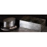 Oval silver snuff box on wooden stand and a rectangular silver cigarette box, 14cm (2) CONDITION