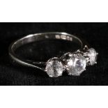 Modern nine carat white gold diamond three stone ring, set with round brilliant cut diamonds, in
