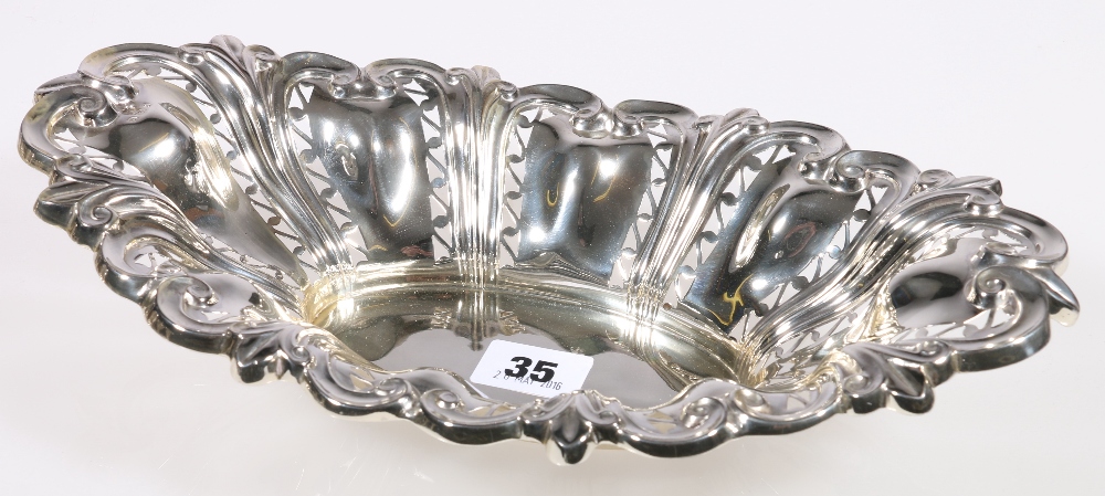 Edward VII silver boat shaped dish with highly ornate fleur de lys and scroll edge and pierced body,