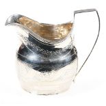 George III silver helmet shaped cream jug with brightcut engraving, London 1801, 90g, 9.5cm.