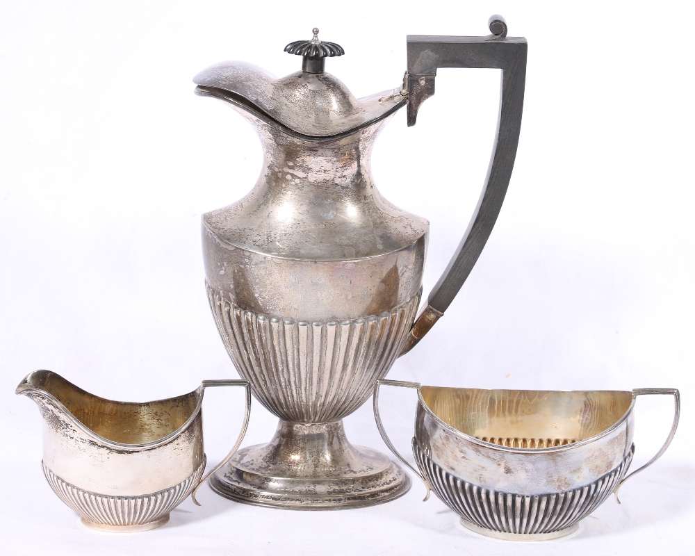 Matched George V and Edward VI silver three piece coffee service of half gadrooned form,