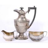 Matched George V and Edward VI silver three piece coffee service of half gadrooned form,