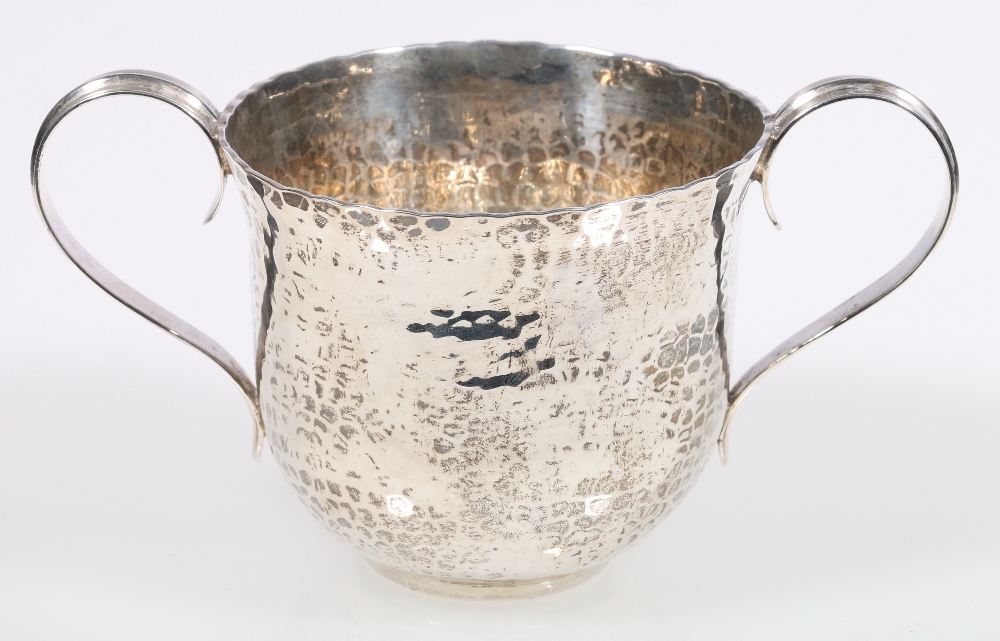 Arts & Crafts hammered silver two-handled cup, maker W A, Birmingham 1908, 139g, 8.5cm.