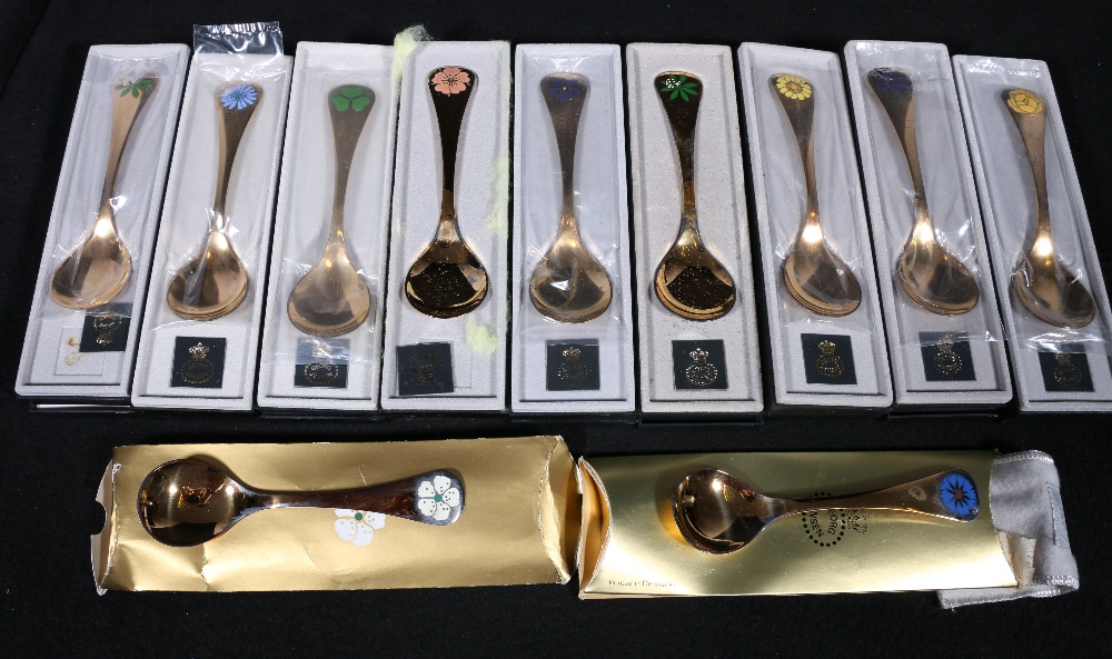 Group of eleven Georg Jensen enamel and silver gilt Christmas Spoons, with boxes and cartons,