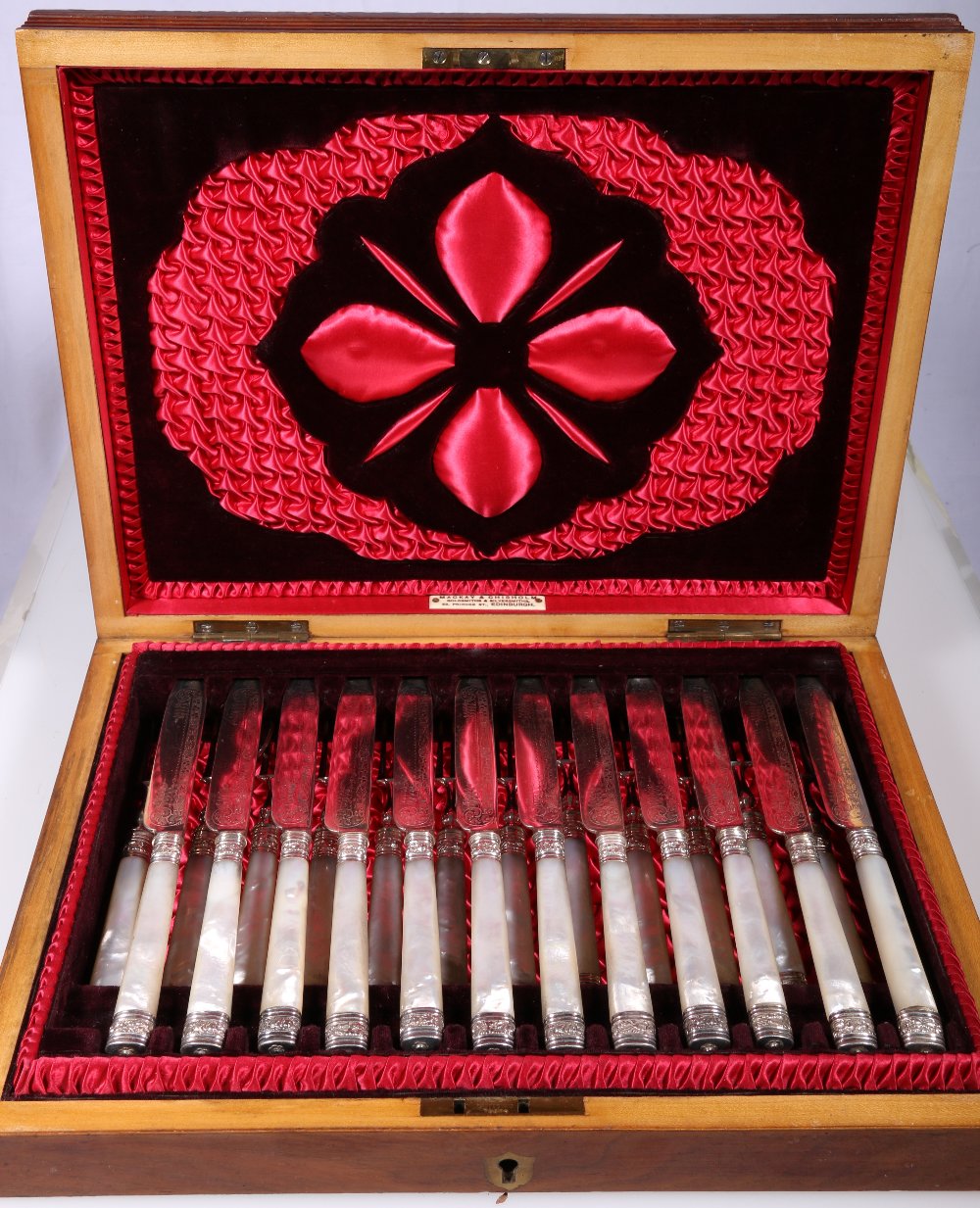 Set of twelve early 20th century fruit knives and forks with plated blades and mother-of-pearl