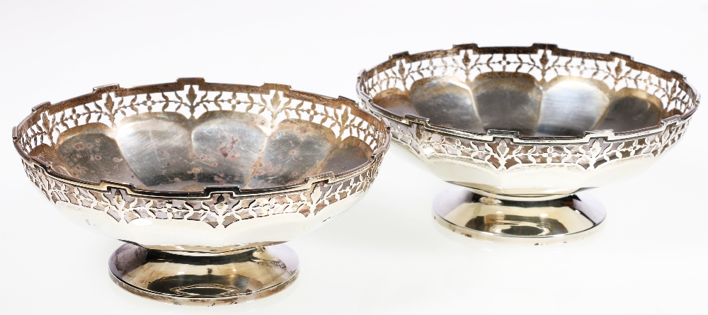 Pair of silver pedestal bonbon dishes, with pierced rims and faceted bowl, Birmingham 1931,