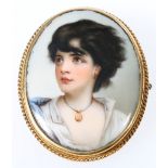 19th century oval porcelain brooch, depicting a young woman wearing a locket,