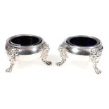 Pair of George III circular silver salts with lion mask and paw feet, London 1774, 329g, 8cm.