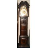 Winterhalder and Hoffmeier carved oak longcase clock, the arched dial with silvered Arabic chapter,