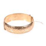 9ct gold half engraved bangle, 29.