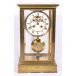 Early 20th century French brass four-glass clock, with enamel Roman chapter and Brocot escapement,