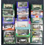 Seventeen Corgi Minis in racing colours, each boxed.