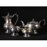 Silver four-piece tea set, of circular form, with gadrooned rim, Maker HW, Sheffield,