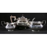 Silver three-piece teaset of serpentine rectangular form, Birmingham 1921,