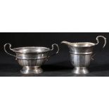 Silver sucrier and cream jug of faceted circular form, Birmingham,