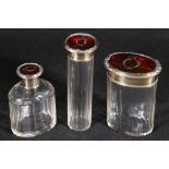 Set of three silver and tortoiseshell lidded toilet jars, 14cm, 10cm and 10.5cm respectively.