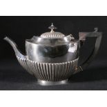 Silver teapot of oval demi fluted form, Birmingham, 592g,