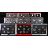 9 Royal Mint United Kingdom Elizabeth II deluxe/executive coin collection year sets 1983, 1984,