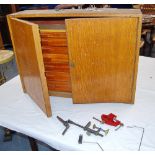 Oak seven-drawer fly tying cabinet with vice, dressings and threads, 51cm high and 72cm wide.