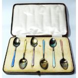 Set of six silver gilt polychrome enamel coffee spoons, 1931/60, cased.